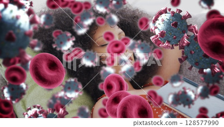 Image of virus cells over african american woman relaxing 128577990