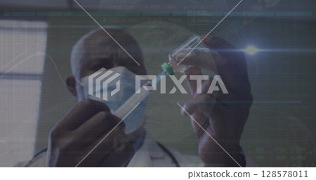 Image of data processing over african american male doctor with face mask with vaccine Image of data processing over african american male doctor with face mask with vaccine 128578011