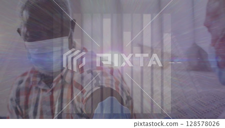 Image of data processing over caucasian male doctor with face mask vaccinating 128578026