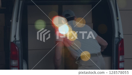 Image of road at night over caucasian male deliverer with cartons Image of road at night over caucasian male deliverer with cartons 128578055