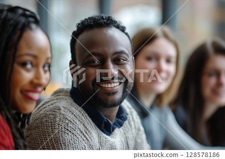 Smiling Group of Friends Enjoying Time Together in a Cafe During Daylight Smiling Group of Friends Enjoying Time Together in a Cafe During Daylight 128578186