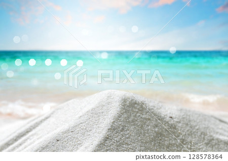 Beautiful sandy beach with an ocean view and a blue sky. Natural background. Summer concept Beautiful sandy beach with an ocean view and a blue sky. Natural background. Summer concept 128578364