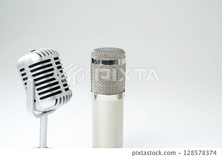 Studio and vintage silver microphone for podcasting or streaming with a white background Studio and vintage silver microphone for podcasting or streaming with a white background 128578374