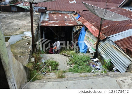 Urban Settlements with Corrugated Roofs and Community Gathering in Nigeria Urban Settlements with Corrugated Roofs and Community Gathering in Nigeria 128578442