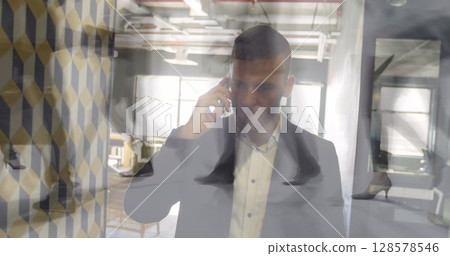 Image of timelapse with walking people over caucasian man having call Image of timelapse with walking people over caucasian man having call 128578546