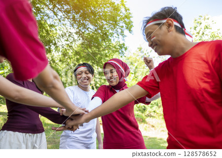 Portrait of an Indonesian southeast asian people celebrate Indonesia Independence Day on the 17th of August. Concept of Kemerdekaan Indonesia Portrait of an Indonesian southeast asian people celebrate Indonesia Independence Day on the 17th of August. Concept of Kemerdekaan Indonesia 128578652