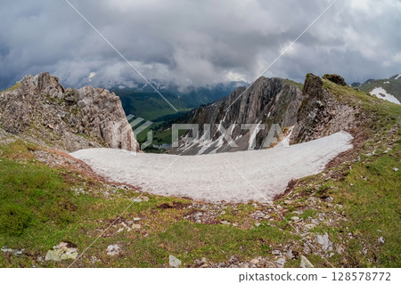 Snow dome and colorful rocky peaked top Snow dome and colorful rocky peaked top 128578772