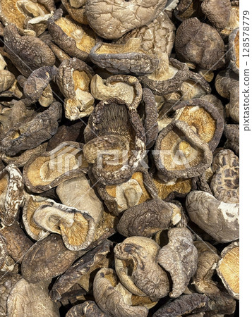 A pile of dehydrated whole mushroom, being sold in an Asian grocery store, A pile of dehydrated whole mushroom, being sold in an Asian grocery store, 128578779