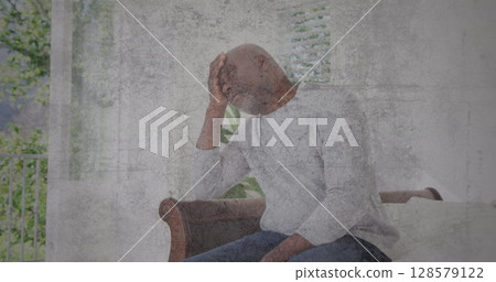 Image of moving background over sad senior african american man Image of moving background over sad senior african american man 128579122