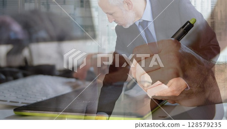Image of caucasian businesswoman with colleague over hand writing 128579235
