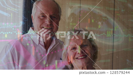Image of diverse data over caucasian senior couple smiling at camera 128579244