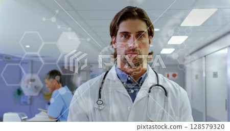 Image of caucasian male doctor in hospital over data processing 128579320