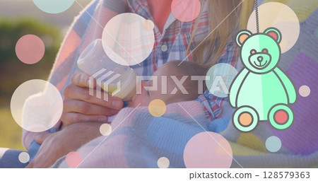 Image of spots over caucasian mother with baby Image of spots over caucasian mother with baby 128579363