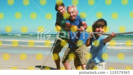 Image of sun icons over happy caucasian family playing at beach 128579365