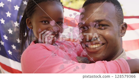 Image of hearts and american flag over happy african american father with daughter 128579366