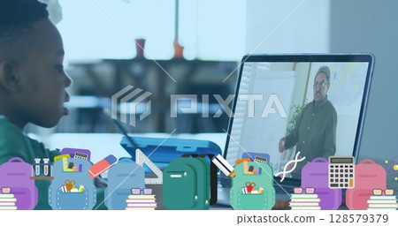 Image of school icons over african american schoolboy having image call with teacher Image of school icons over african american schoolboy having image call with teacher 128579379