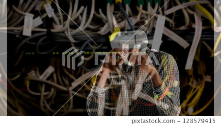 Image of men using vr headset over server room Image of men using vr headset over server room 128579415