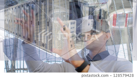 Image of men using vr headset over server room 128579428