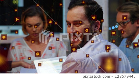Image of network of connections with icons over business people Image of network of connections with icons over business people 128579443