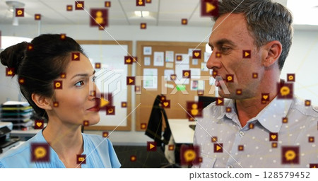 Image of network of connections with icons over business people Image of network of connections with icons over business people 128579452