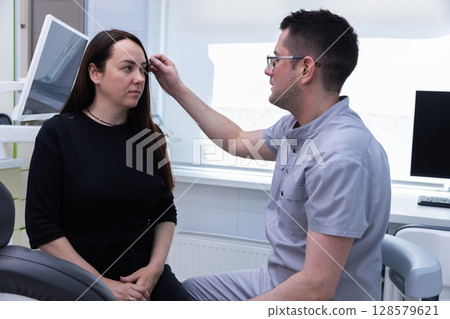 Professional Consultation in a Modern Clinic: Understanding Aesthetic Procedures While Ensuring Client Comfort and Satisfaction Through Expert Guidance and Care Professional Consultation in a Modern Clinic: Understanding Aesthetic Procedures While Ensuring Client Comfort and Satisfaction Through Expert Guidance and Care 128579621