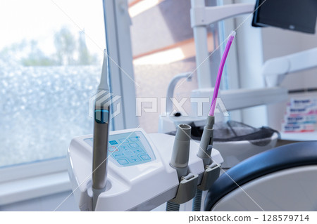 Modern Dental Equipment Ready for Patients with Advanced Tools for Oral Care in a Bright and Clean Clinic Setting Featuring a High-Tech Environment for Dentistry 128579714