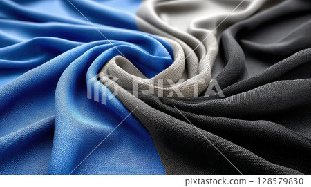 Abstract swirling blue, black, and gray fabrics creating vortex pattern 128579830