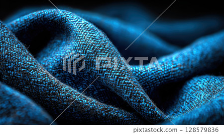 Close-up of woven blue fabric with intricate texture and depth Close-up of woven blue fabric with intricate texture and depth 128579836
