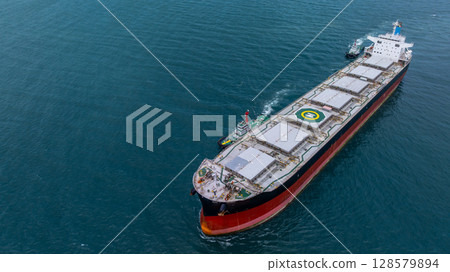 Aerial view bulk carrier cargo ship vessel global business logistic import export industry, Bulk carrier cargo ship vessel dry general cargo vessel underway on sea to port. 128579894