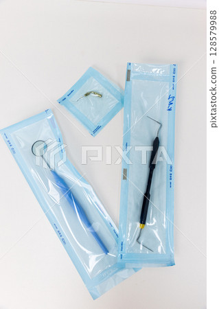 Dental Tools Prepared for Use: Hygienically Packaged Instruments for Oral Care and Procedures in a Clinical Setting Ready for Patients and Dental Care Professionals to Utilize Dental Tools Prepared for Use: Hygienically Packaged Instruments for Oral Care and Procedures in a Clinical Setting Ready for Patients and Dental Care Professionals to Utilize 128579988