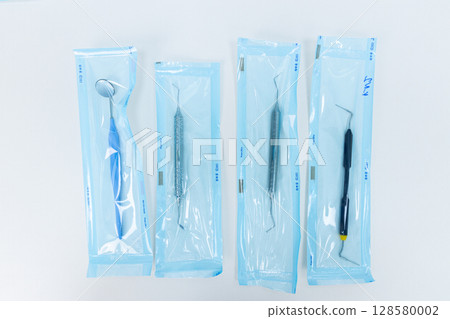 Set of Dental Instruments in Sterile Packaging for Oral Health Procedures and Dental Care, Designed for Professional Use by Dentists and Dental Hygienists Set of Dental Instruments in Sterile Packaging for Oral Health Procedures and Dental Care, Designed for Professional Use by Dentists and Dental Hygienists 128580002