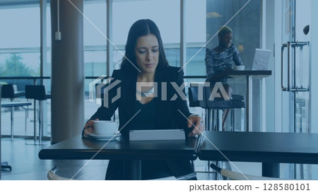 Flat design showing woman with coffee and tablet while coworker working on laptop in office cafe Flat design showing woman with coffee and tablet while coworker working on laptop in office cafe 128580101
