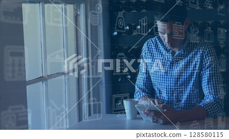 Flat design is showing man interacting with tablet at table with coffee cup and financial icons 128580115