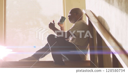 Image of glowing lights of water over a sad senior african american man Image of glowing lights of water over a sad senior african american man 128580734