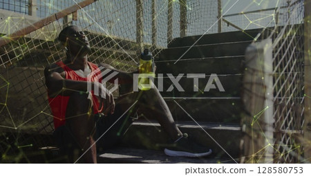 Image of network of connections over african american sportsman Image of network of connections over african american sportsman 128580753