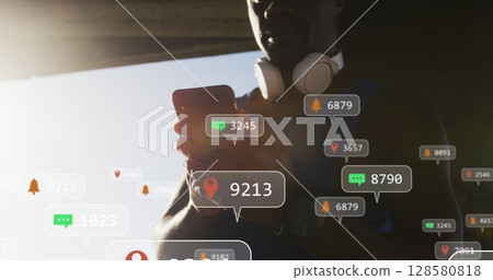 Image of icons over an exercising african american man Image of icons over an exercising african american man 128580818