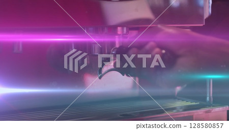 Image of light spots over african american man preparing coffee in cafe Image of light spots over african american man preparing coffee in cafe 128580857