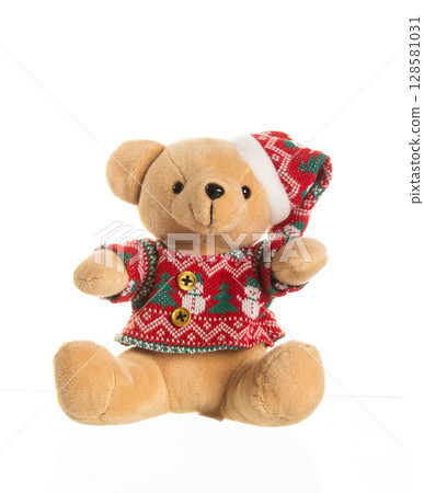 Cute plush teddy bear wearing a red Christmas sweater and Santa hat, sitting on white background Cute plush teddy bear wearing a red Christmas sweater and Santa hat, sitting on white background 128581031