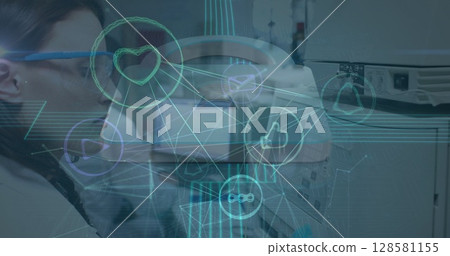 Image of network of connections with icons over diverse doctors 128581155