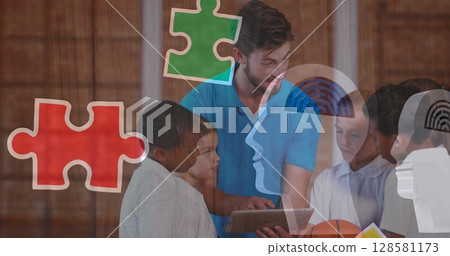 Image of puzzle pieces over diverse schoolchildren using tablet 128581173