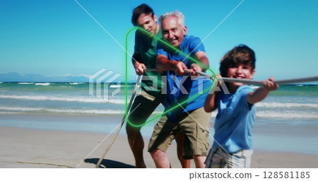 Image of play over happy multigeneration caucasian family having fun on beach Image of play over happy multigeneration caucasian family having fun on beach 128581185
