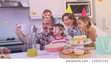 Image of emoticons over happy caucasian family during birthday party taking selfie Image of emoticons over happy caucasian family during birthday party taking selfie 128581193