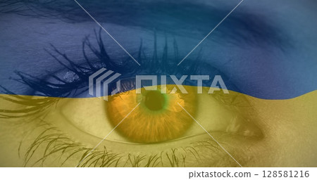 Image of flag of ukraine waving over open eye of caucasisan woman 128581216