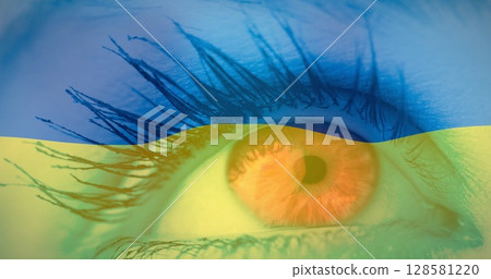 Image of flag of ukraine waving over open eye of caucasisan woman Image of flag of ukraine waving over open eye of caucasisan woman 128581220