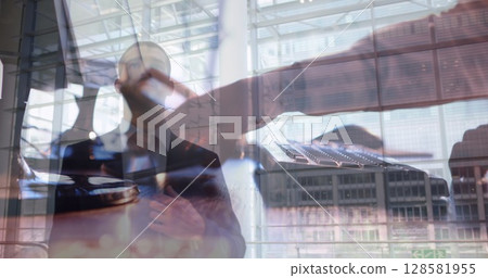 Image of men using computer over businessmen 128581955