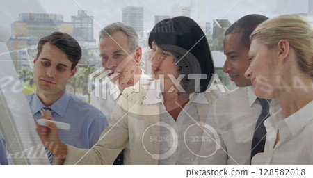 Image of data processing and clock over diverse business people taking notes 128582018