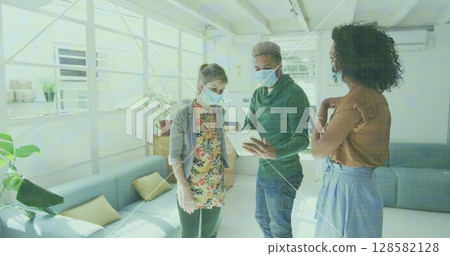 Image of data processing over businesswomen wearing face masks Image of data processing over businesswomen wearing face masks 128582128