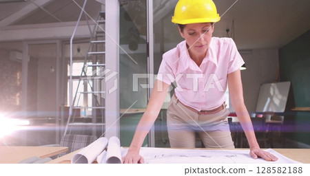 Image of light trails over caucasian female engineer Image of light trails over caucasian female engineer 128582188