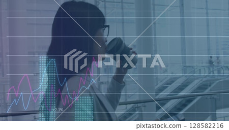 Image of financial data processing over biracial businesswoman Image of financial data processing over biracial businesswoman 128582216