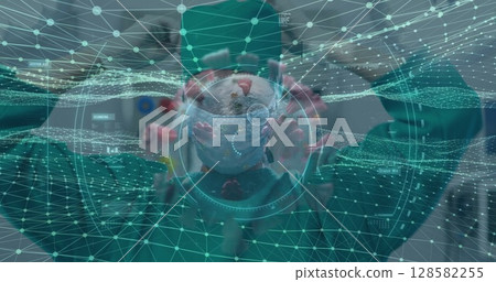 Observing experienced surgeon studying holographic virus model in lab, with teal network grid 128582255